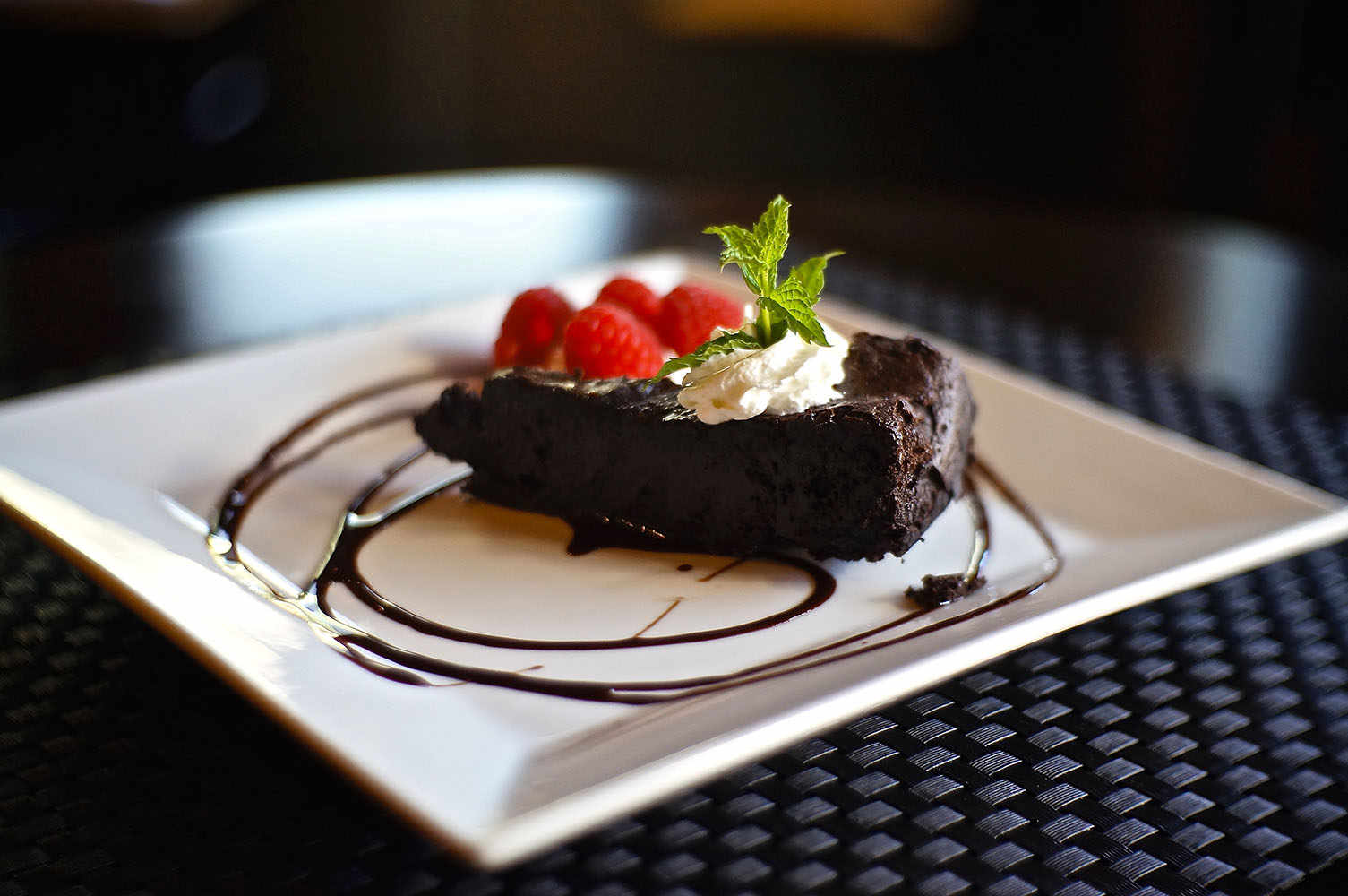 Eight Cuisine and Wine dessert menu chocolate cake with raspberries